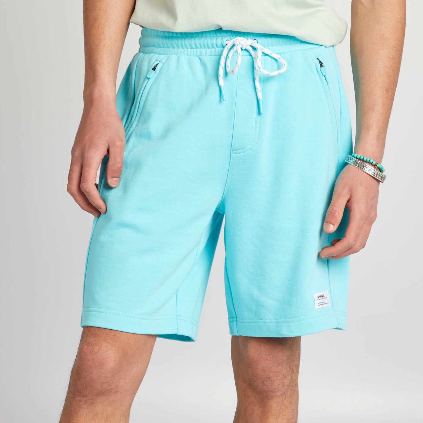 Short en molleton avec poches zippées bleu turquoise