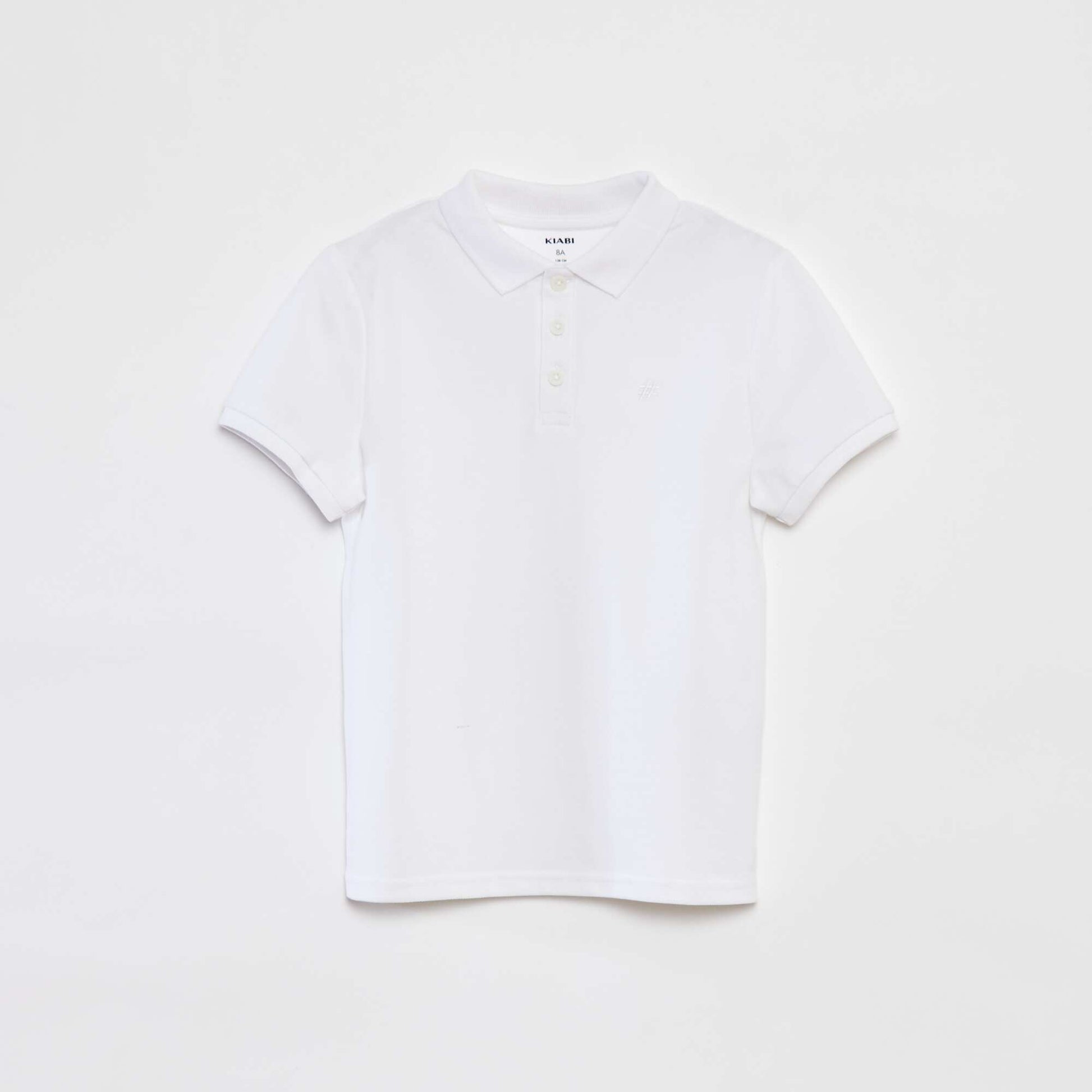 Polo uni en piqué de coton BLANC
