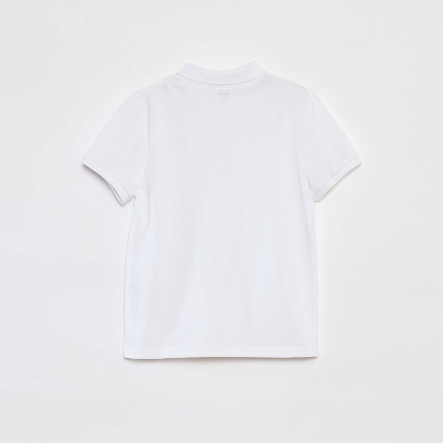 Polo uni en piqué de coton BLANC