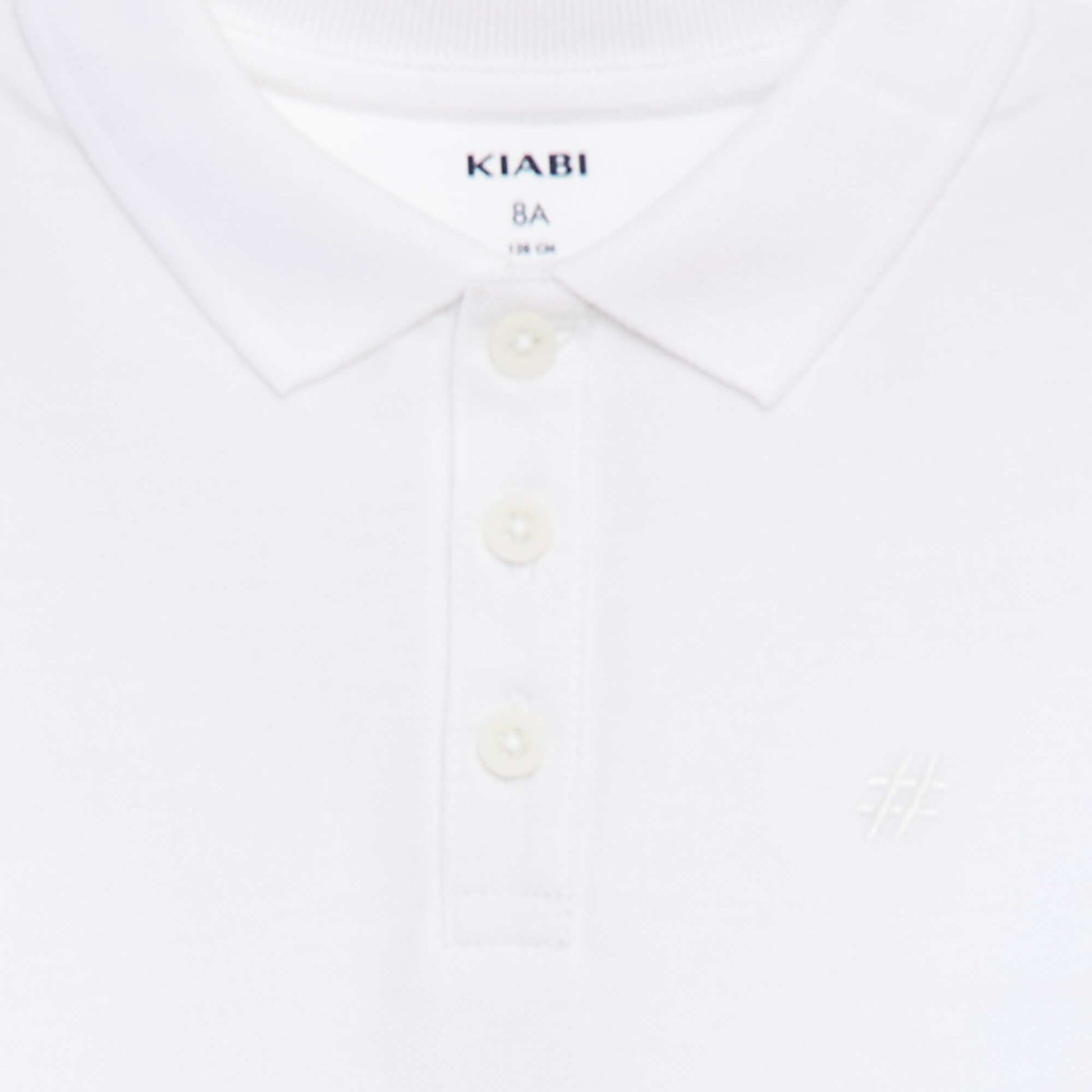 Polo uni en piqué de coton BLANC